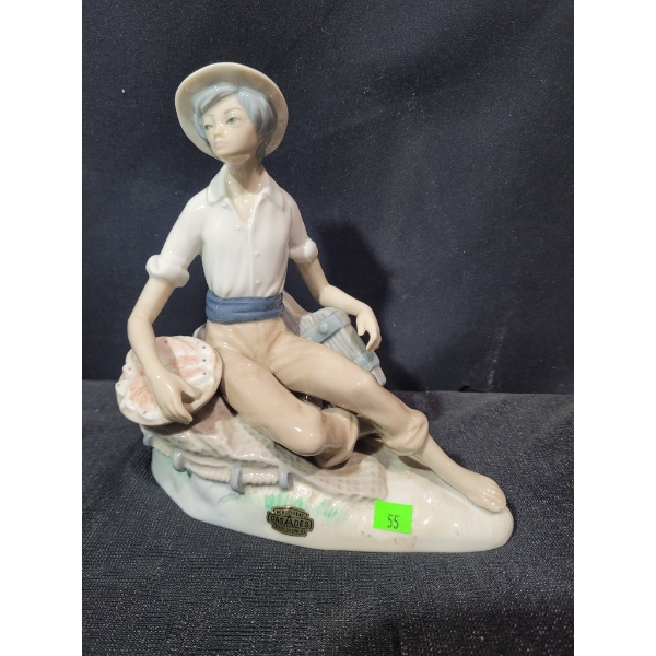 Porcelain Figurine of Seated Young man by Casades Spain