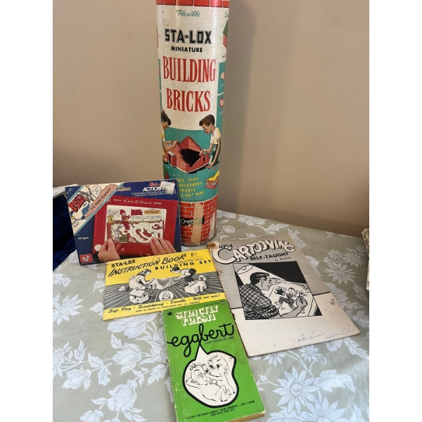 vintage cardboard tube of Sta-Lox miniature building bricks, a collectible toy set originally produc