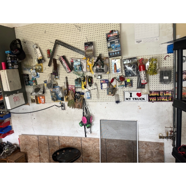  Everything hanging on the wall in the photos as one lot, including a reproduction, tractor seat cha