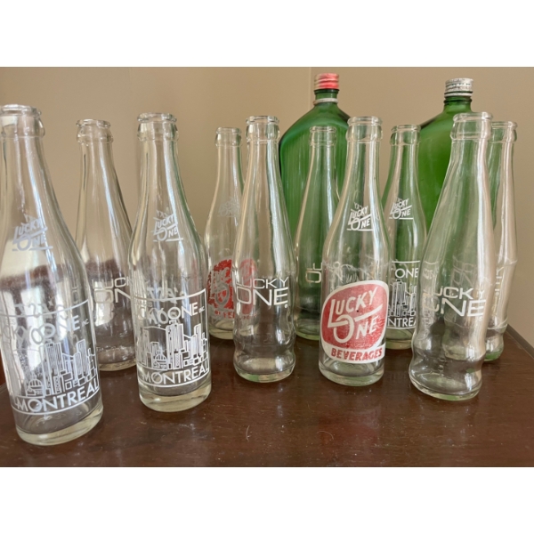  vintage Lucky One beverage bottles, likely from the 1970s
