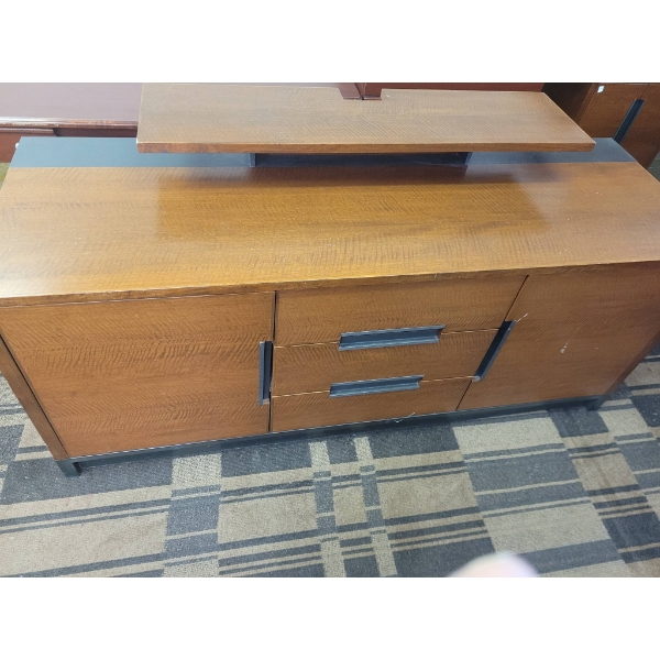 Brown Three Drawer Dresser with Metal Accents and Storage Compartments/ Shelf