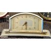 Image 15 : Decorative Clocks, Philishave Razor, and Peacock Artwork Display