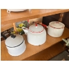 Image 2 : vintage white enamelware colander, likely featuring a black rim and footed base. Large kettle, doubl