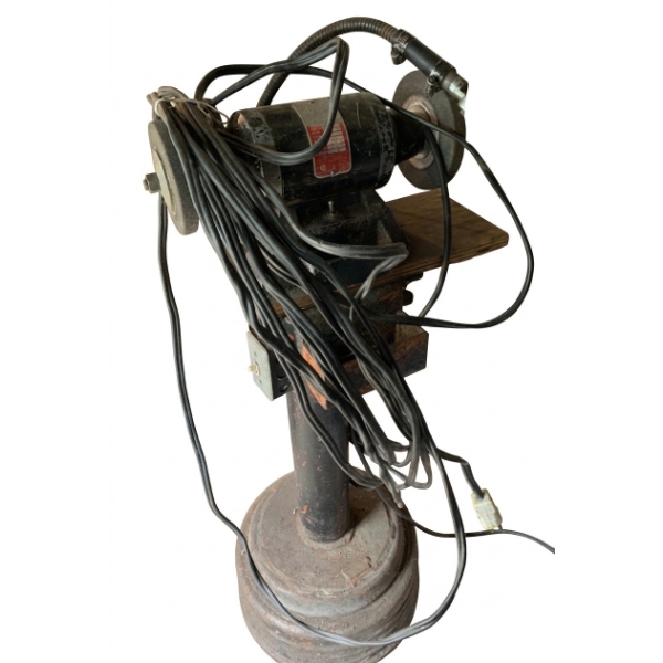 Industrial Bench Grinder Mounted on Pedestal with Attached Light