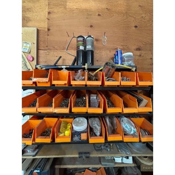 wall mounted screw bin organizer with all contents, must bring tools to remove off the wall