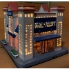Image 2 : Illuminating Holiday Homes: Nexxtec Walmart and Lemax Playhouse (Awning is Unglued) 