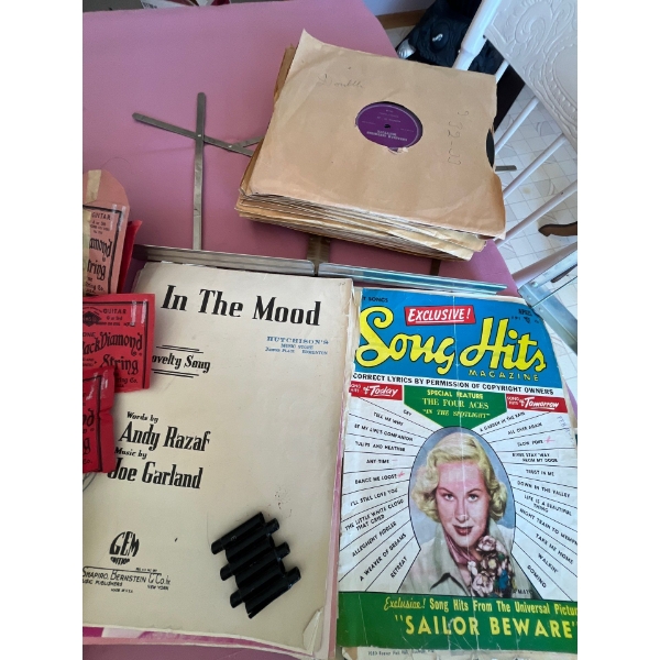 collection of vintage placemats books plate holders candle holder Massey -Harris original poster.