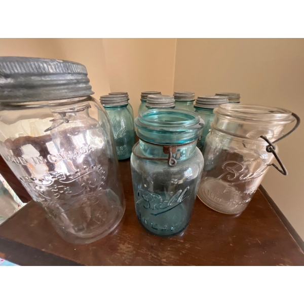 collection of antique and vintage blue mason jars, and one crown made in Canada