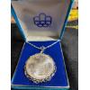 Image 1 : 1976 Olympic $10 Silver Coin on Silver chain and pendant 66.05g with original blue Velvet Box