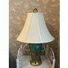 Image 2 :  Vintage porcelain table lamp in a robin egg blue color with brass hardware. Soft white shades .