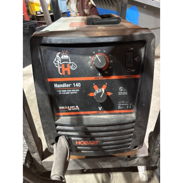 Hobart Handler 140 welder and Cart. With extra rolls of welding wire 