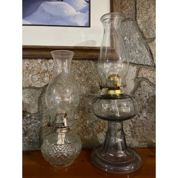 Two oil lanterns, both with glass very unique bases