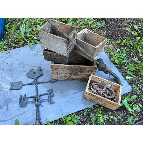 Antique boxes, horseshoes, weathervane, and McCormik Deering Antique scale.