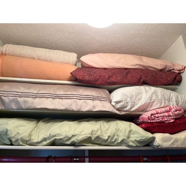 Selection of bedding, blanket, pillows, and throws include king-size pillows and wool blankets.