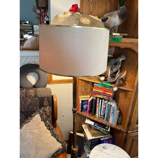 collection of books, vintage retro lamp, and marble and brass side table