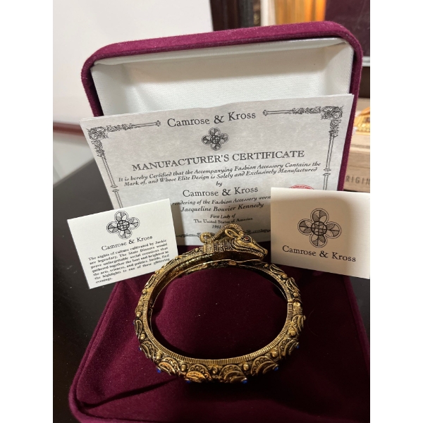 Camrose and Kross With the Manufacture Certificate Is A Rendering of The Fashion Accessories Worn By