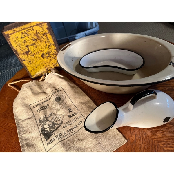 Pee bottles and wash basins along with a vintage tin and South African water bag