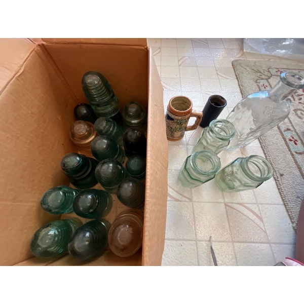 Antique bottles and insulators .