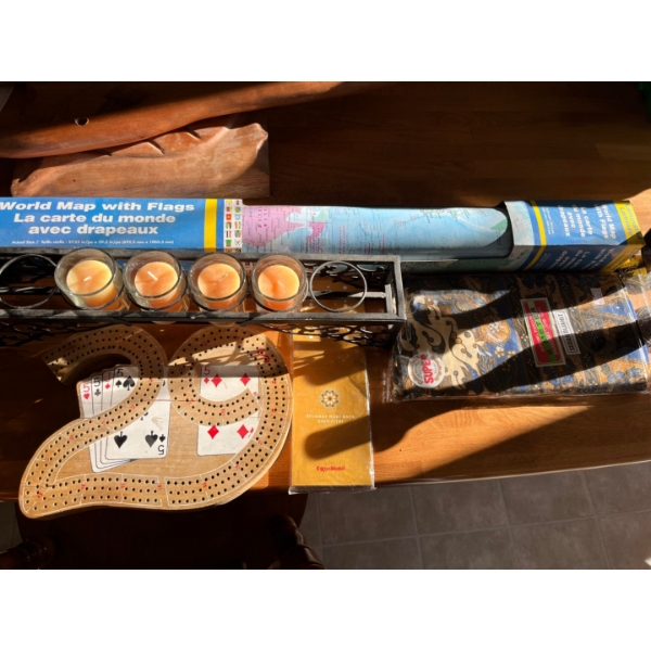  large world map with flags candle holder with candles and two black carved candle holders with scar