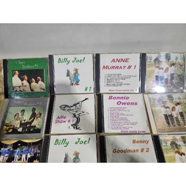 16 Compact Discs Featuring Various Artists and Genres