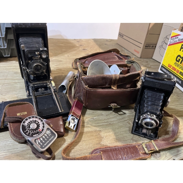  two antique cameras with a number of vintage camera accessories by Weston light exposure monitor Ze