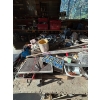 Image 6 : shop table with electric motors, Arius tools, pipe vintage license plate, plates, axis sledgehammer 
