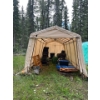 Image 1 : Carport with contents made by shelter logic in good condition also a pile of tongue and groove board