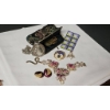 Image 5 : Vintage Jewelry and Collectibles Including Necklace, Brooches, and Stamps Tokens in Clutch Purse