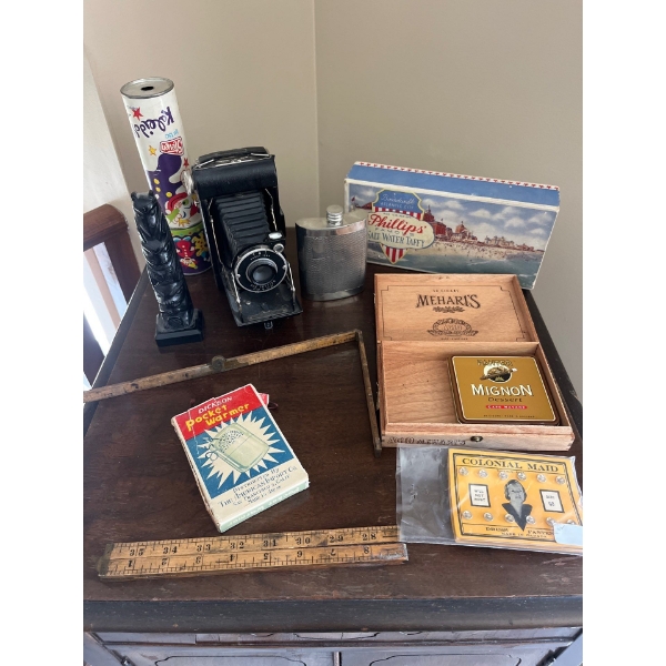Antique camera and folding tape measures with cigar box a vintage Phillies, famous salt, water, taff