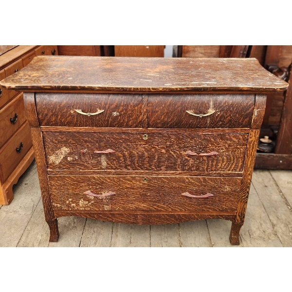Older Wooden Dresser Featuring Four Drawers and Requiring Repair