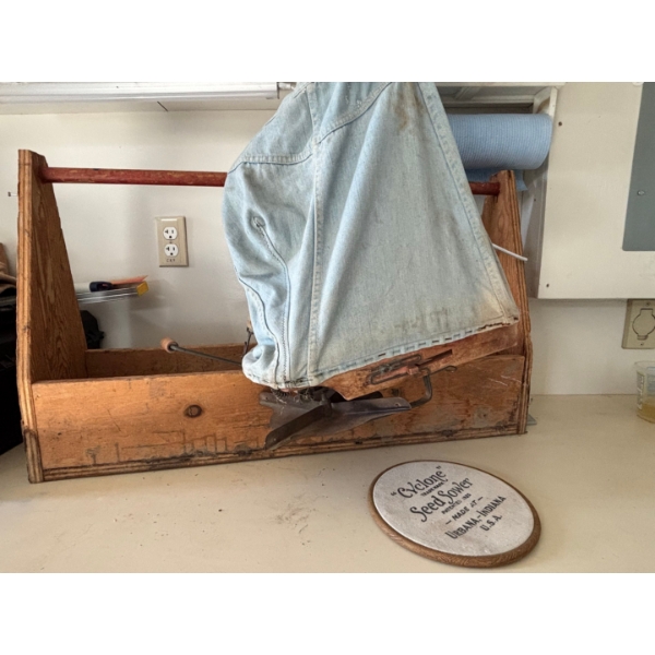 Antique cyclone seed thrower made in URBANA Indiana USA with a large wooden toolbox 