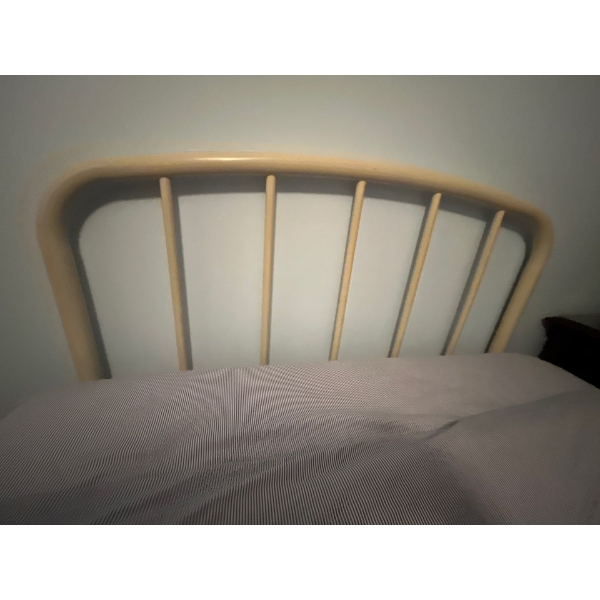 cream coloured enamel, headboard and frame, bedding and mattress, not included size double