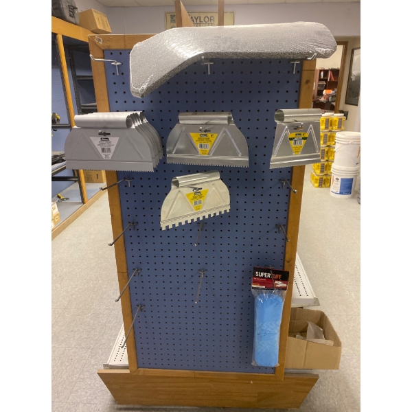 Display of Adhesive Spreaders and Accessories for Flooring and Construction