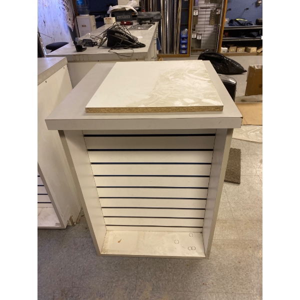White Wooden Display Stand With Slatted Panels and Sanitizer Dispenser