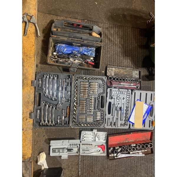 Large collection of socket sets, wrenches, and a number of other tools in toolboxes