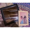 Image 2 : Decorative Lot Featuring Framed Mirror, Framed Artwork, Braided Rug, and Floral Mat