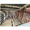 Image 1 :  Collection of blowers and other antique farm implements, including pump and antique bricks