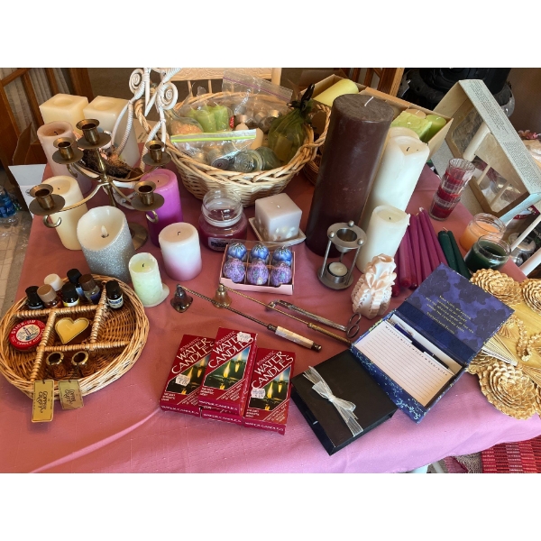  large collection of candles, candle holders, and baskets. Include sense for your candles, as well a