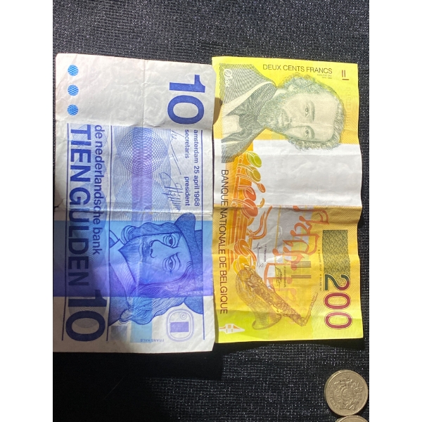 World Currency Notes and Assorted Coins Featuring Various Designs