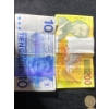 Image 1 : World Currency Notes and Assorted Coins Featuring Various Designs