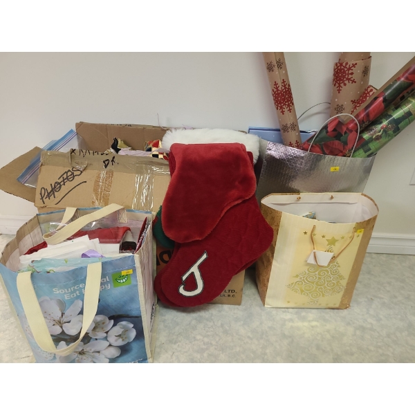 Assorted holiday decorations and wrapping paper/ gift  bags, stockings