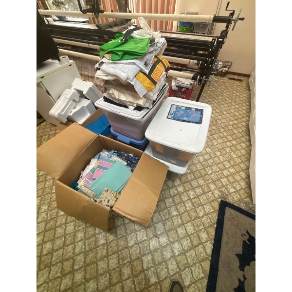  four bins and one box of fabric a number of different patterns started for a quilting project all s