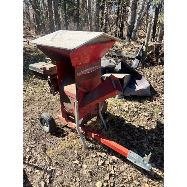 Troy-Bilt Super Tomahawk chipper/shredderpowered by an 8 HP Briggs & Stratton engine with cover.