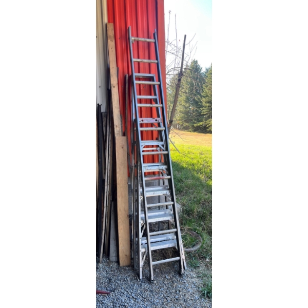 Three aluminum ladders. 