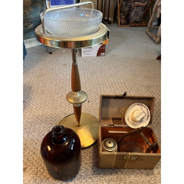 Vintage retro wood and brass ashtray with a brown gallon jug and vintage cowboy art