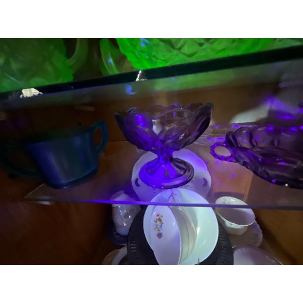  collection of purple and white uranium glass on shelf five