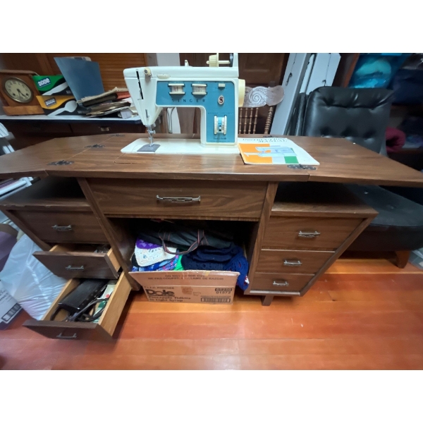 vintage electric, singer, sewing machine with retro sewing machine table with a number of drawers an