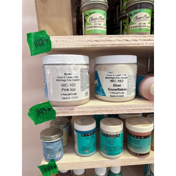 whole row of 2 ounce under glaze and 16 ounce