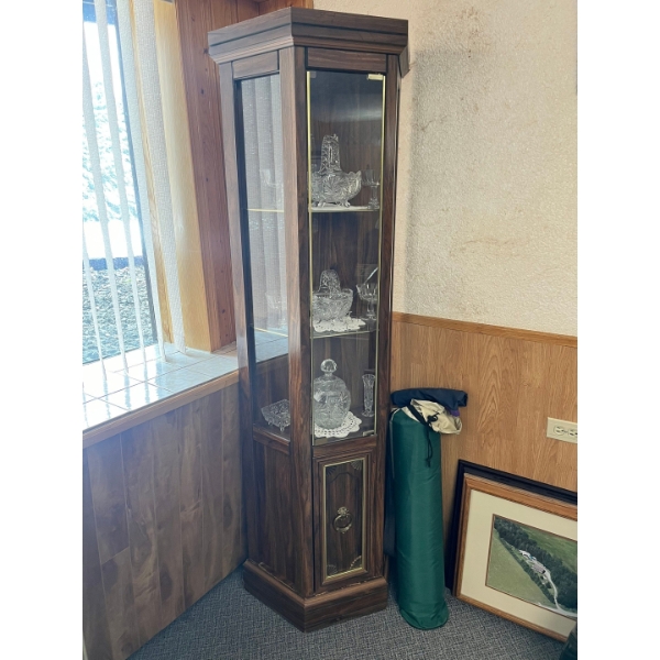 Three tier corner cabinet with bottom storage. 72” l x 22”w x 11”D. Contents not included. 