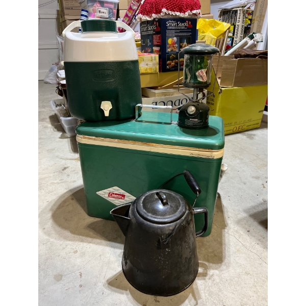 Vintage Coleman cooler with green vintage thermos, water, jug, black camp kettle and a small Coleman